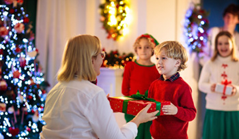 Child receiving a Christmas present